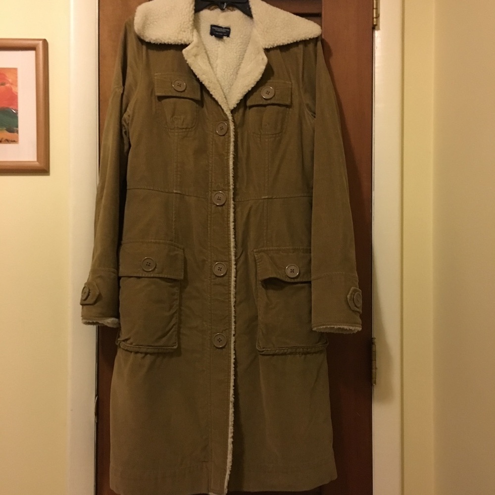 Tan long winter coat with fleece lining.